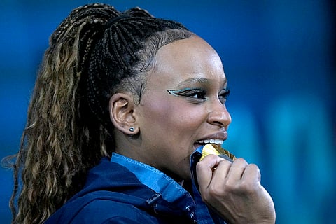 Rebeca Andrade celebrates after winning the gold medal